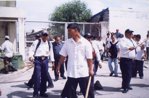 Security guards and police beat Chong Won workers